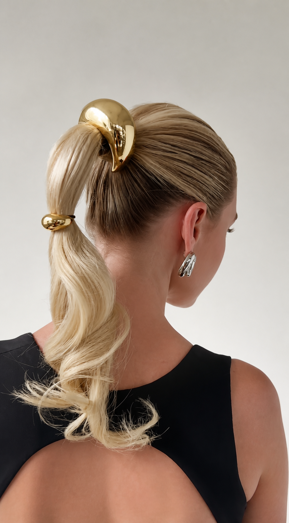 Load video: Pony cuffs and braid cuffs styled as modern hair jewelry.